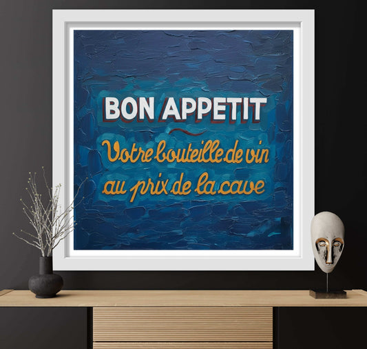 Framed artwork with 'Bon Appetit' text on a blue background, displayed on a shelf.