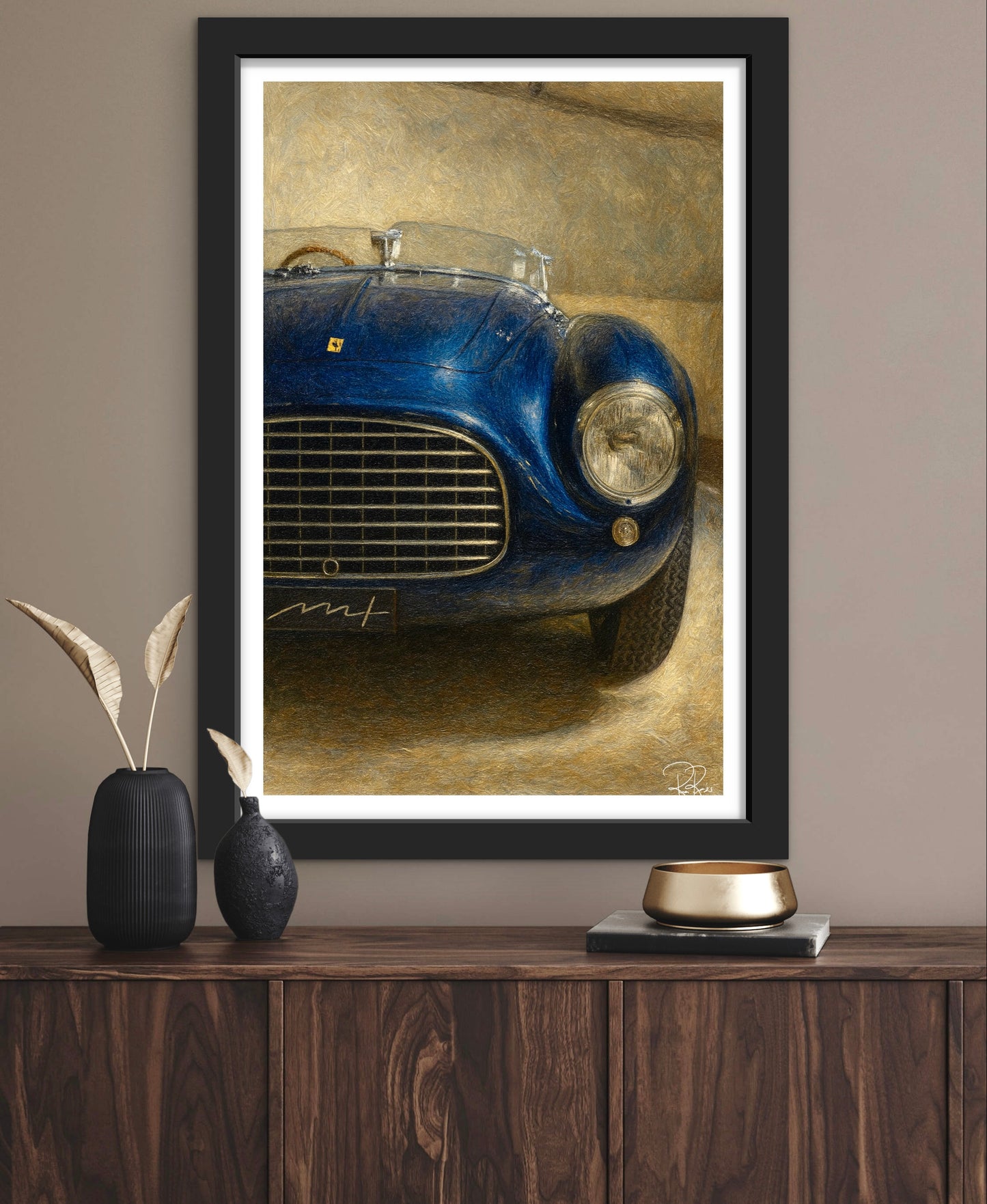 Framed artwork of a blue vintage car on a wooden shelf with decorative items.