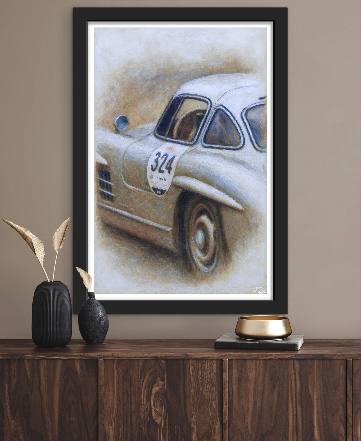 Framed painting of a vintage car on a wooden shelf with decorative items.