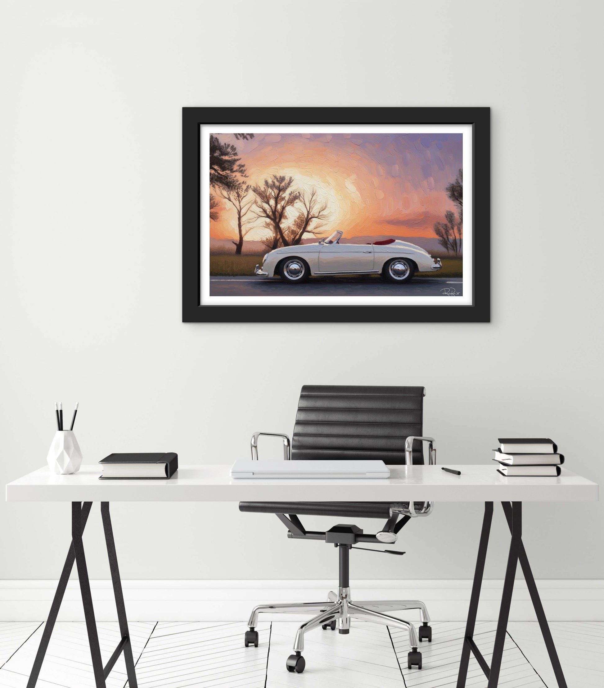 Framed artwork of a classic car at sunset above a desk with office furniture.