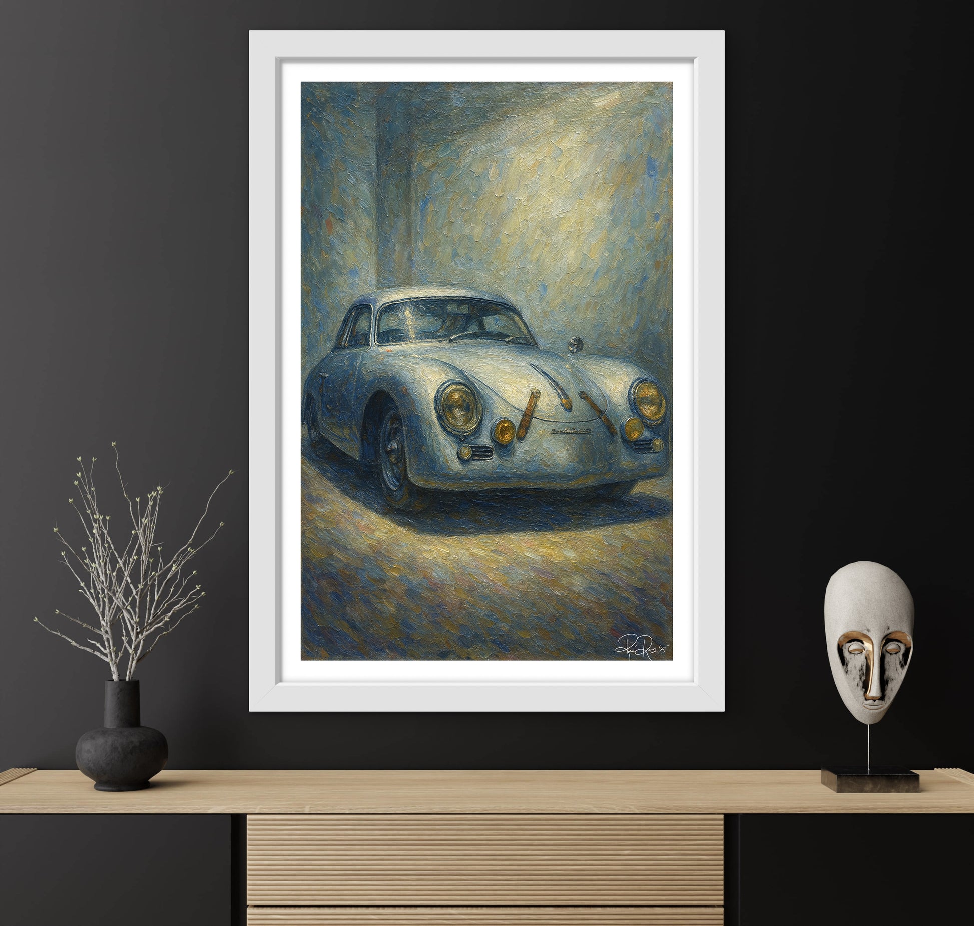 Framed painting of a vintage car on a dark wall with decorative items below.