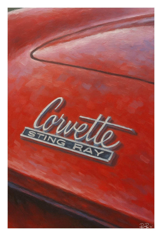 Red Corvette Sting Ray emblem on a car hood