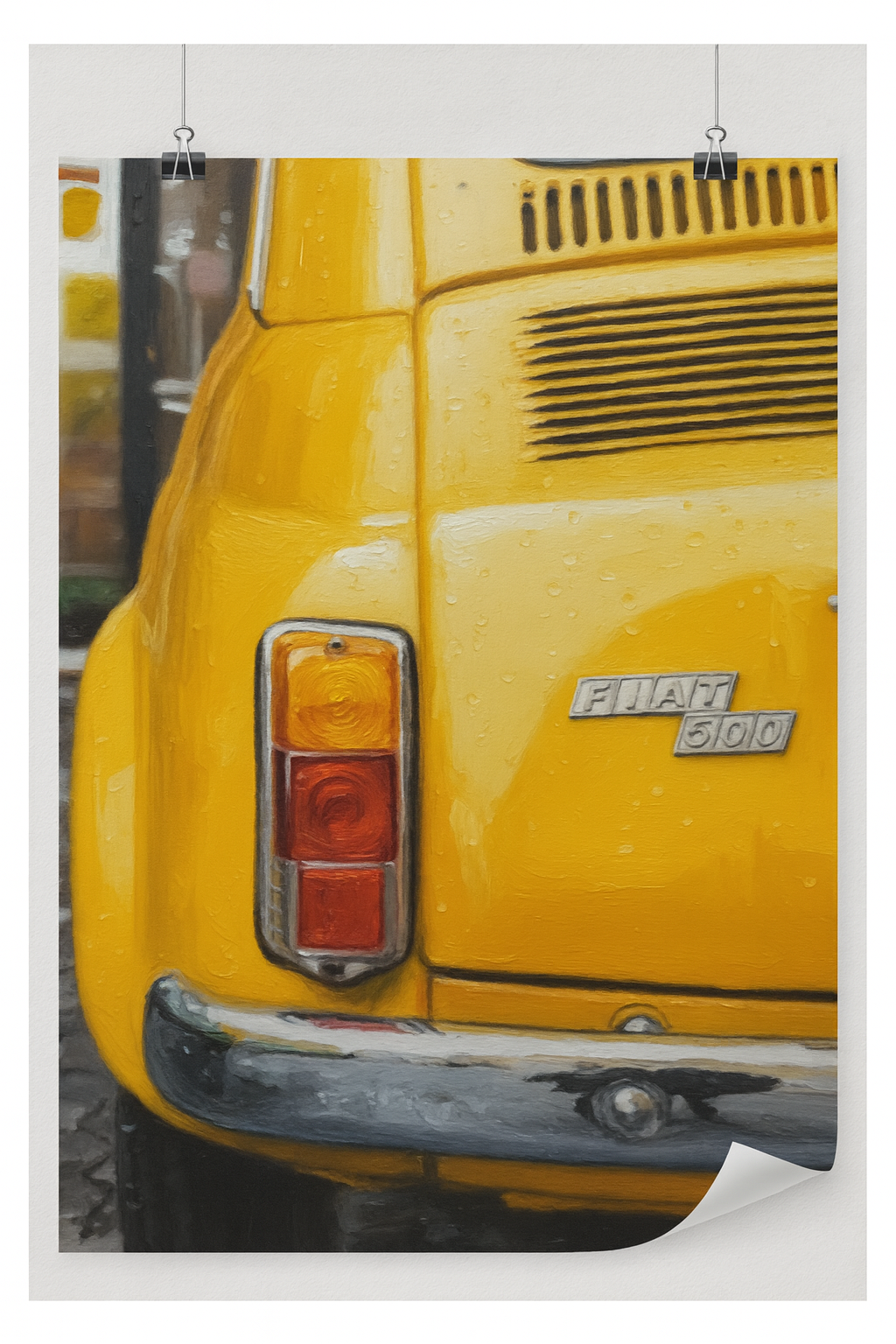 Close-up of a yellow Fiat 500 car with visible branding.