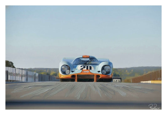 Vintage race car on a track with a clear sky