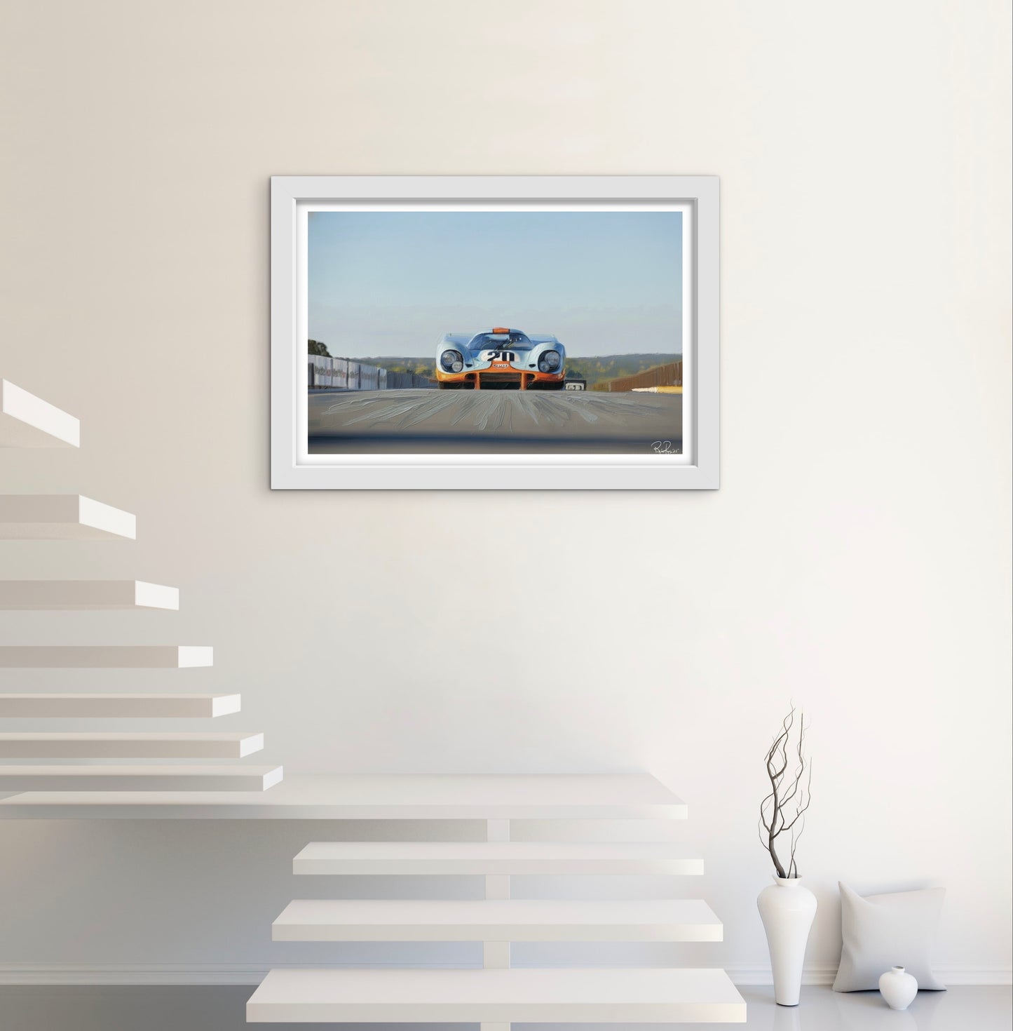 Framed artwork of a race car on a wall in a modern interior setting