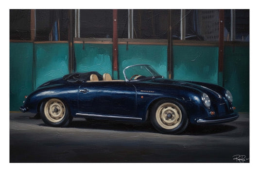 Blue vintage convertible car parked in front of a teal wall.