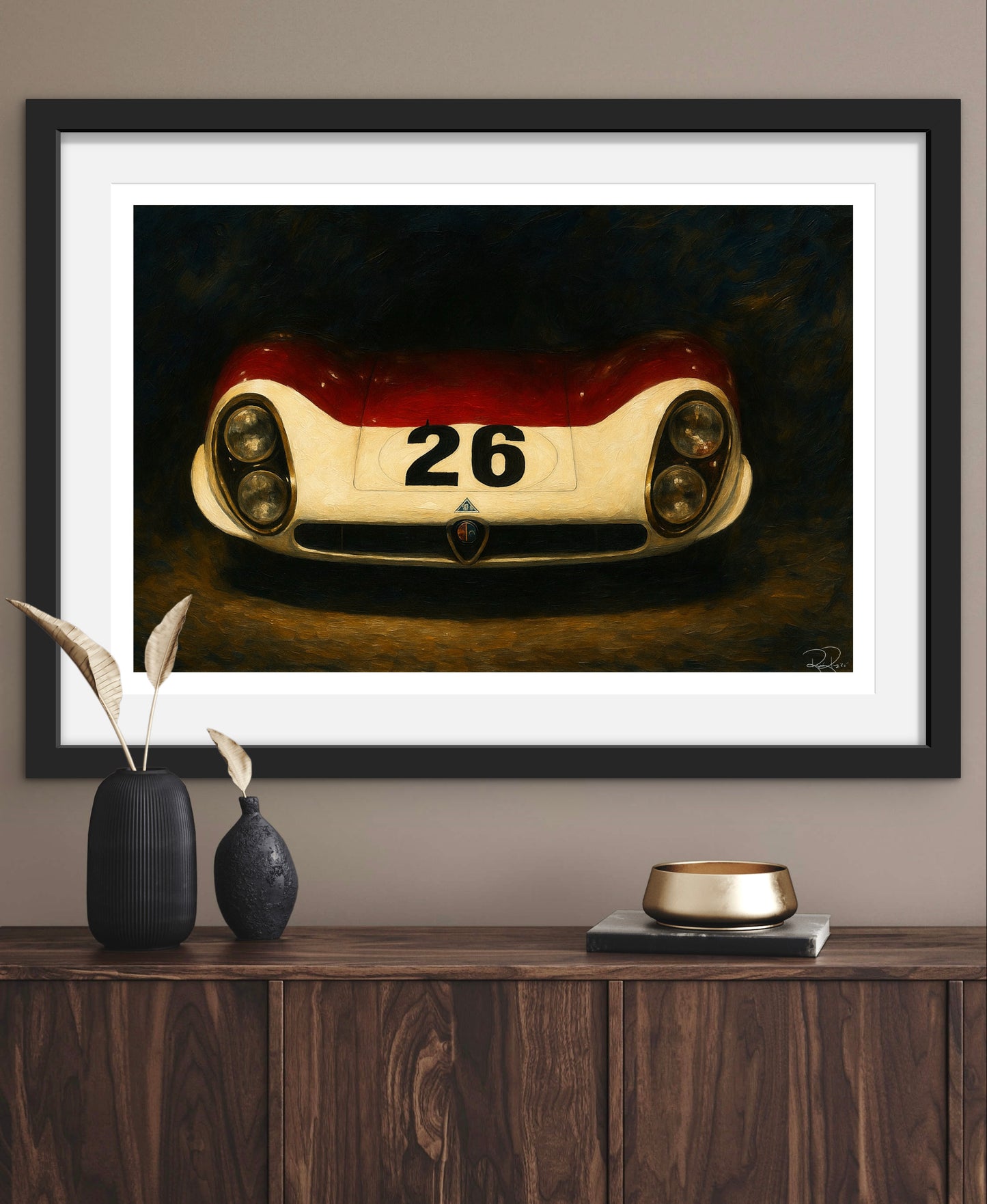 Framed artwork of a vintage race car on a wall above a wooden cabinet.