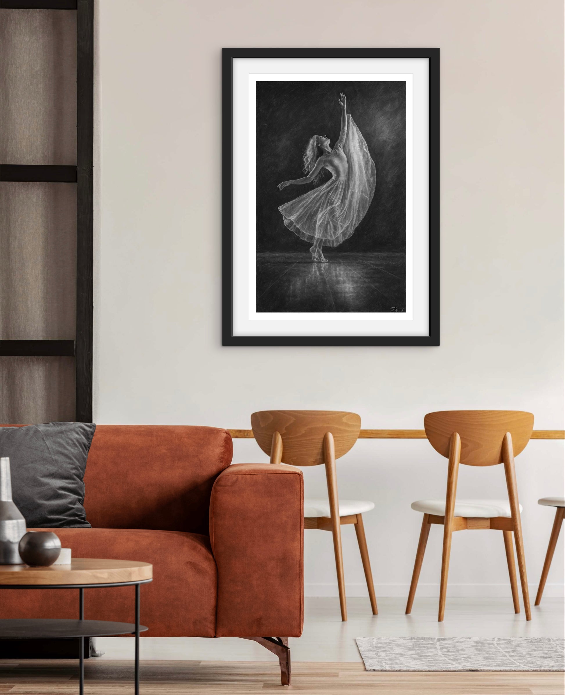 Framed black and white art print of a dancer in a modern living room.