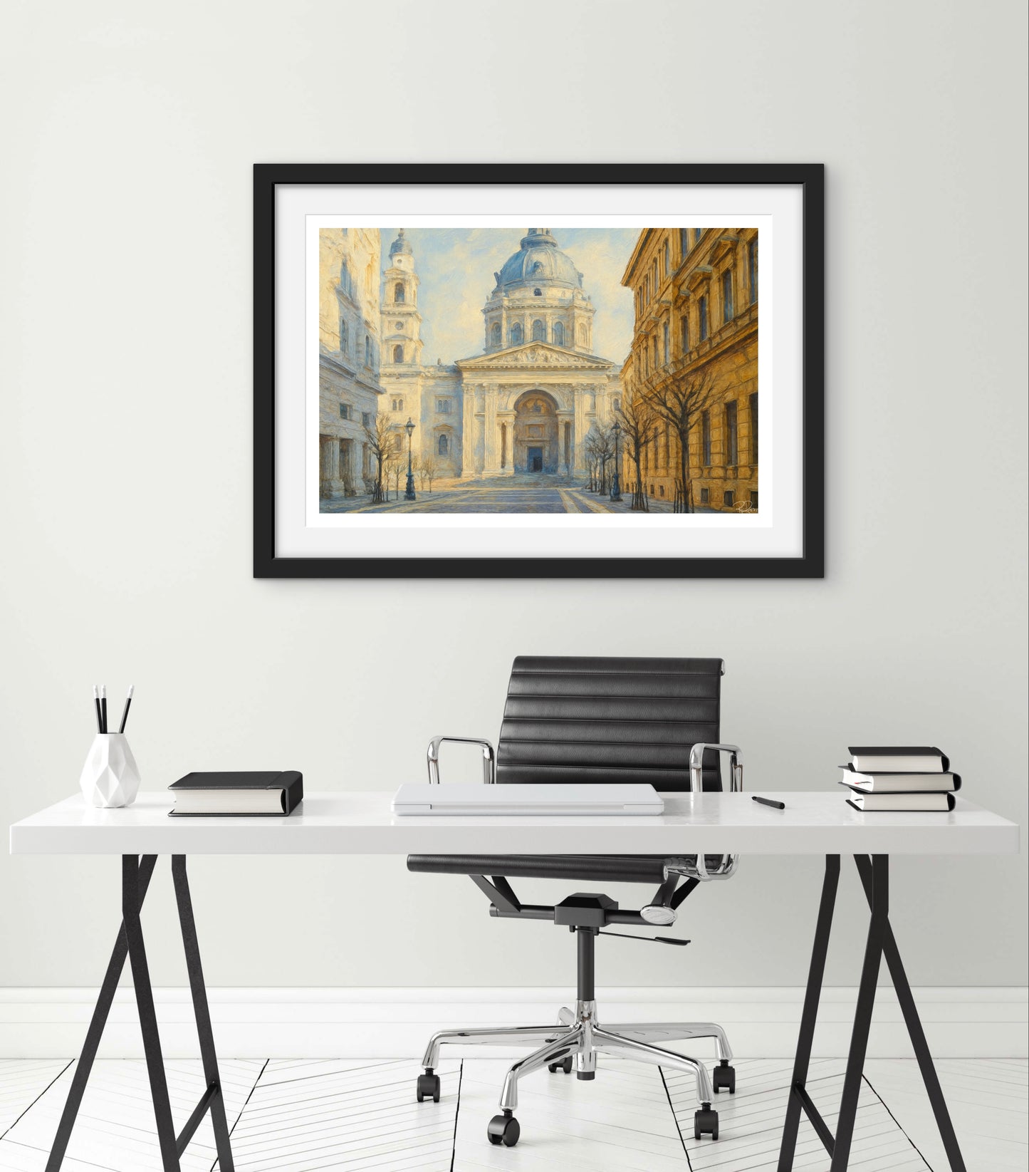 Framed artwork of a cityscape above a modern office desk with a chair.