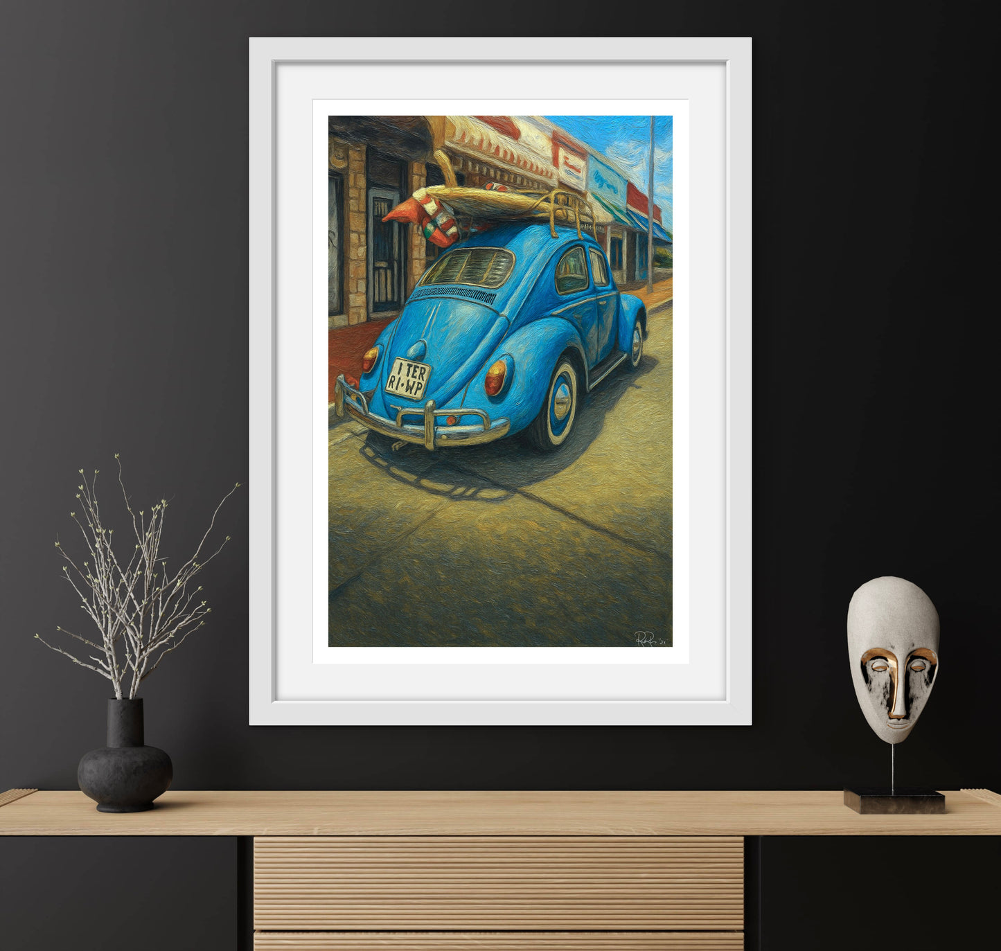 Framed painting of a blue vintage car on a dark wall with decorative items.