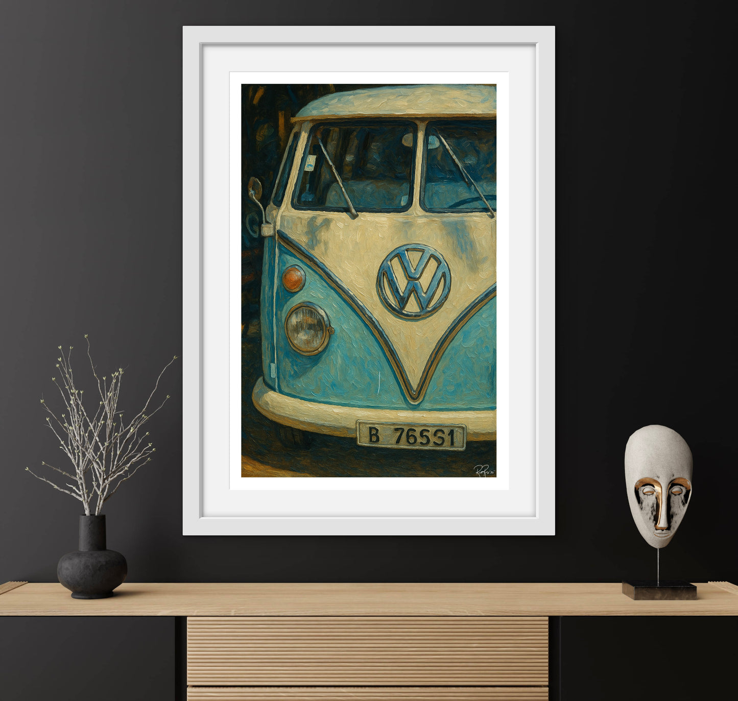 Framed artwork of a vintage Volkswagen van on a dark wall with decorative items.