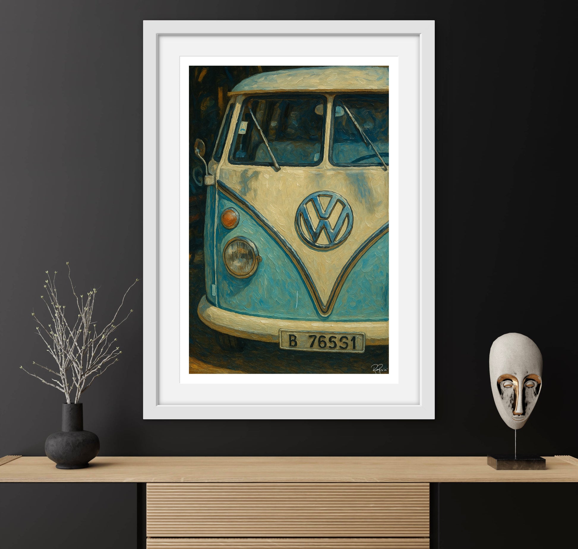Framed artwork of a vintage Volkswagen van on a dark wall with decorative items.