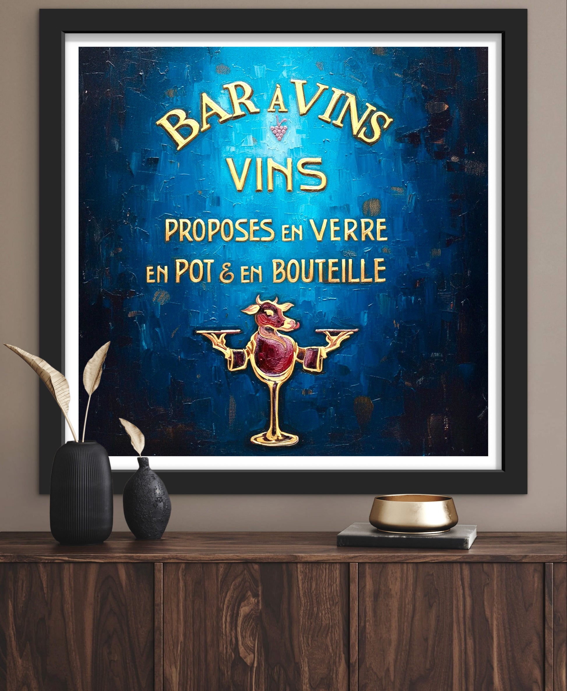 Framed vintage-style wine advertisement on a wall above a wooden shelf.