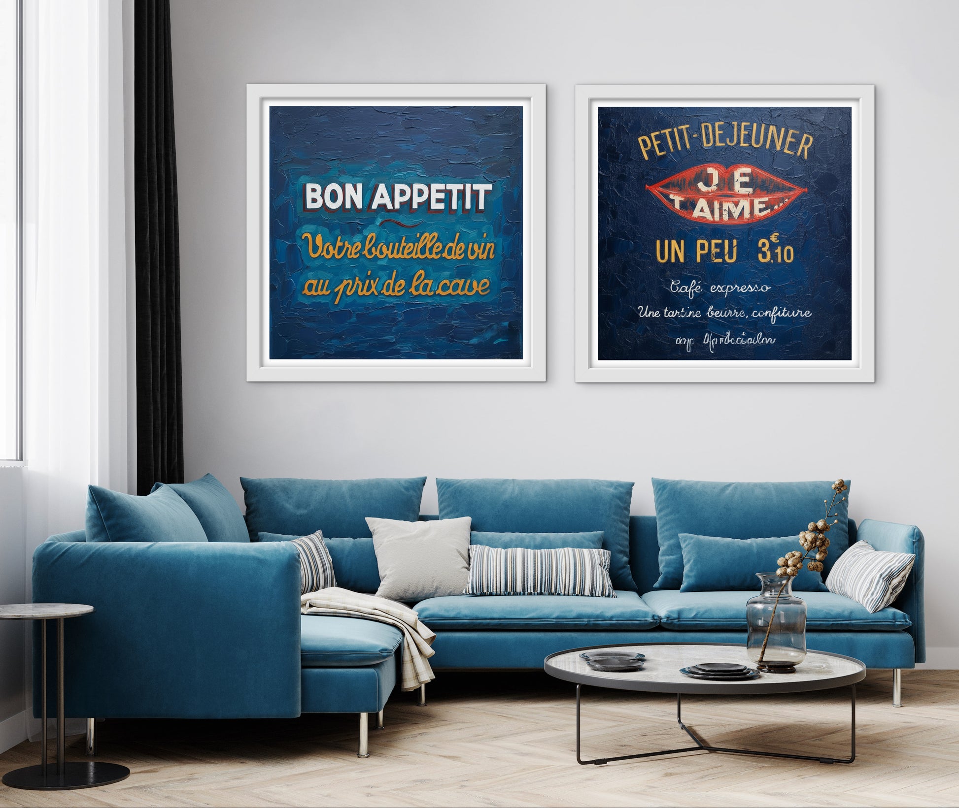 Living room with blue sectional sofa and two framed posters on the wall.