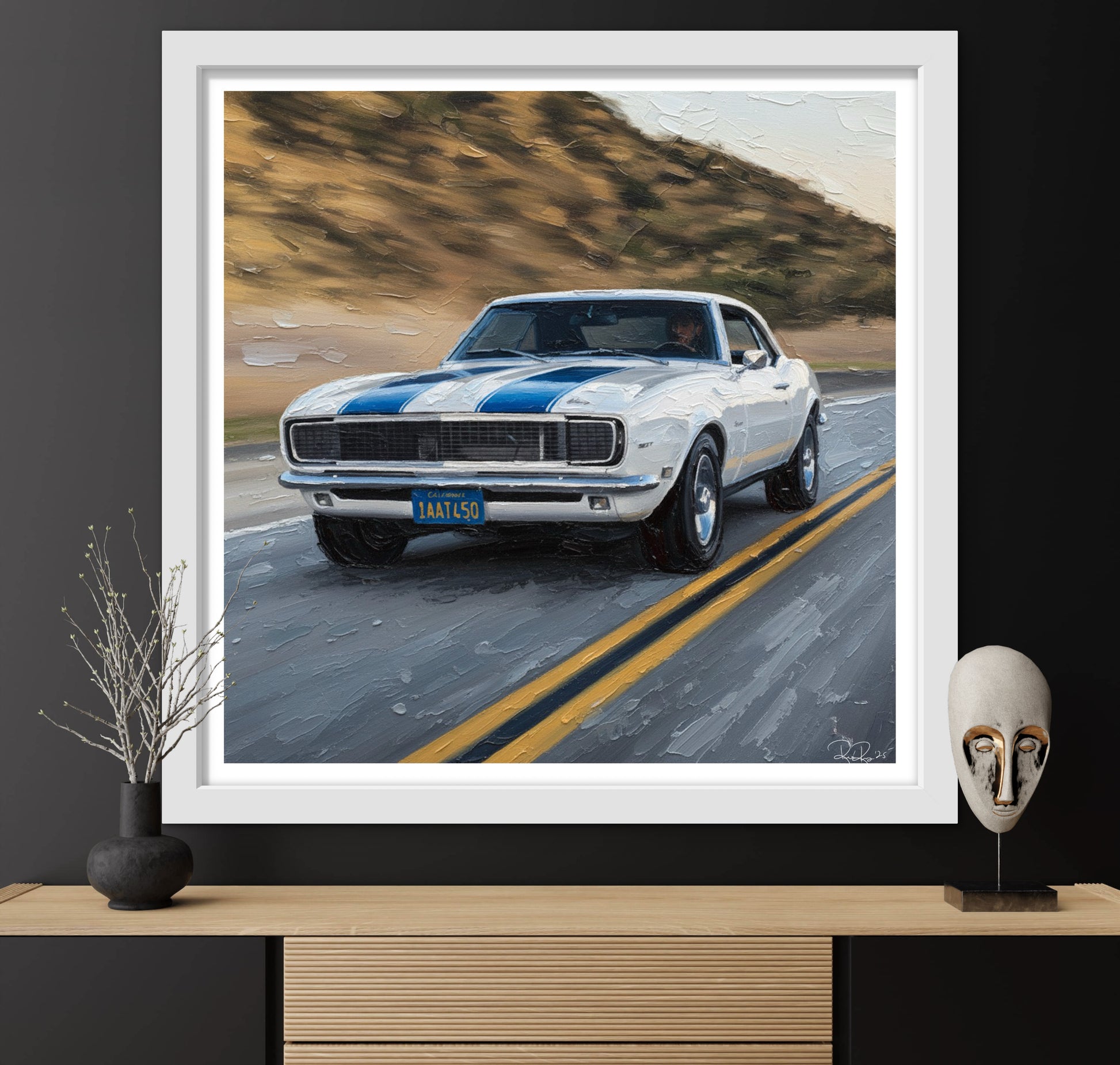 Framed artwork of a classic car on a road with a white border.