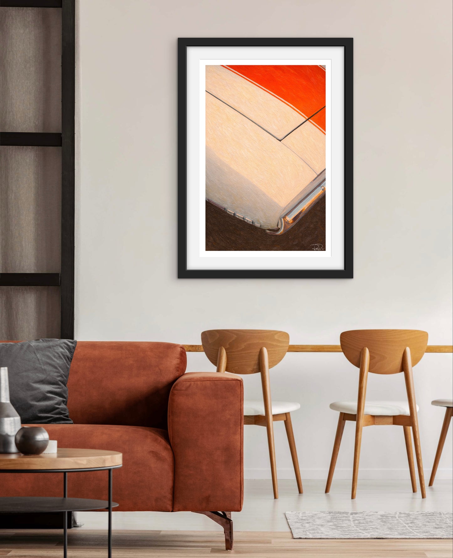 Framed abstract art piece on a wall above a brown sofa in a modern living room.