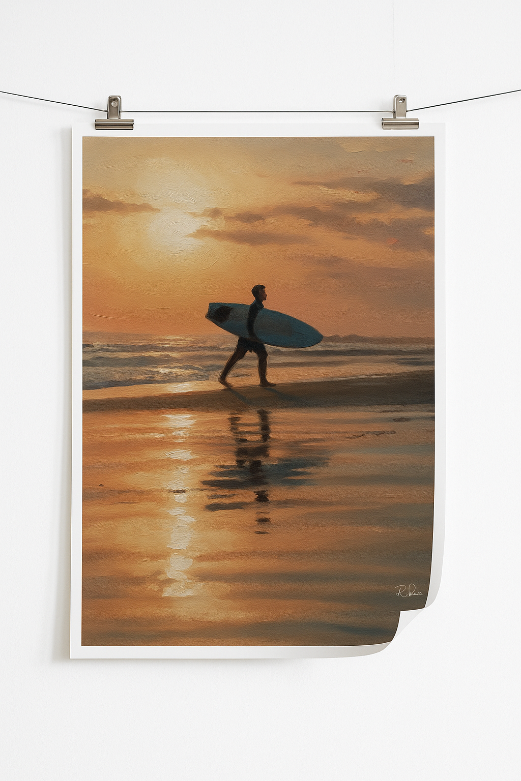 Man walking on a beach with a surfboard at sunset