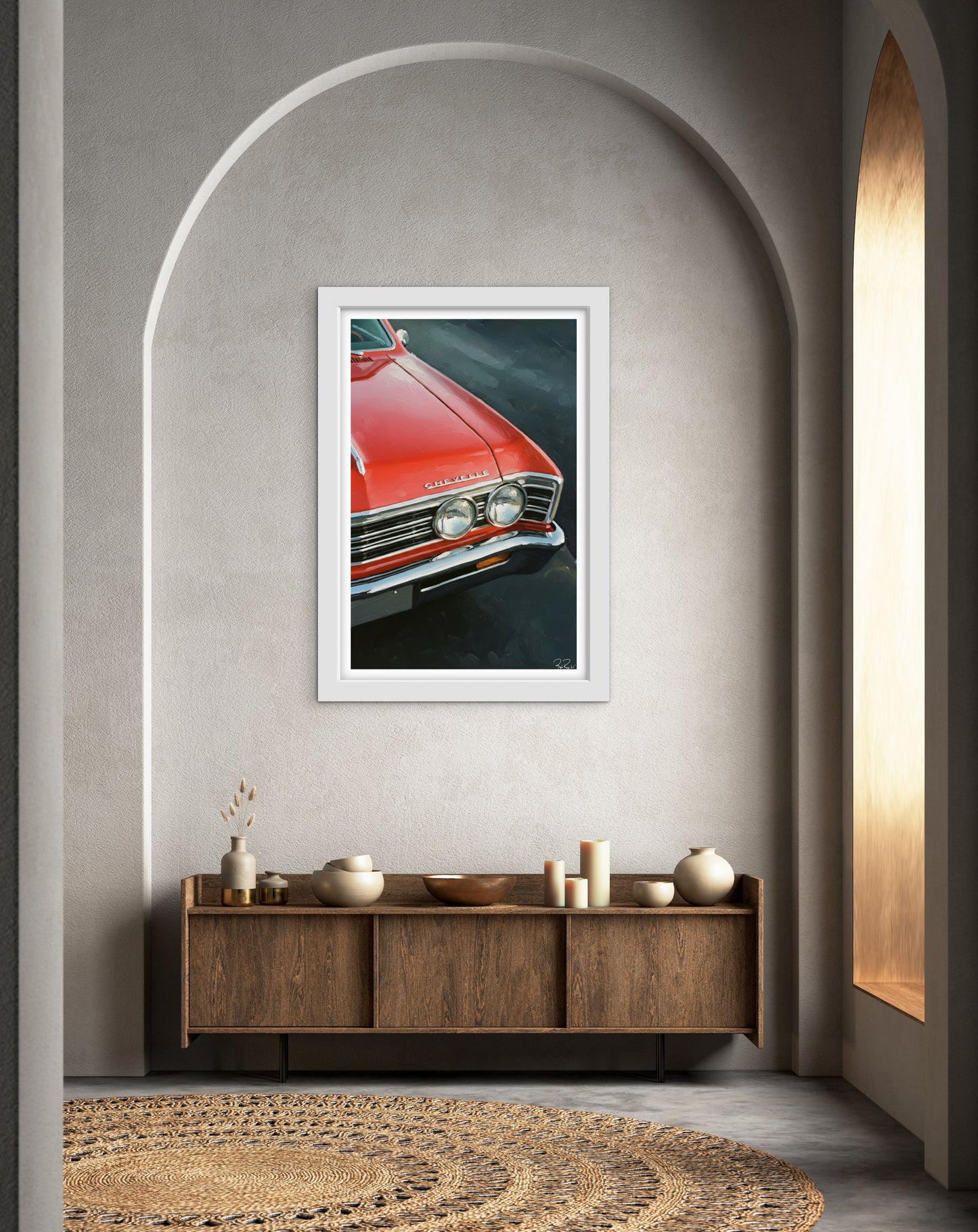 Framed picture of a red car on a wall above a wooden cabinet.