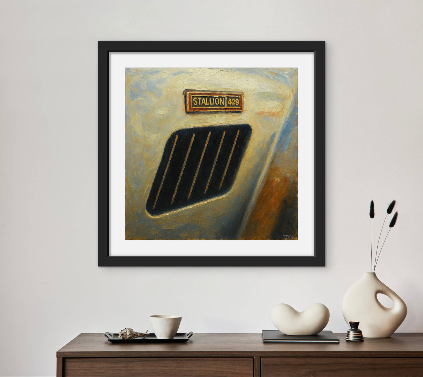 Framed abstract painting on a wall above a wooden console table with decorative items.