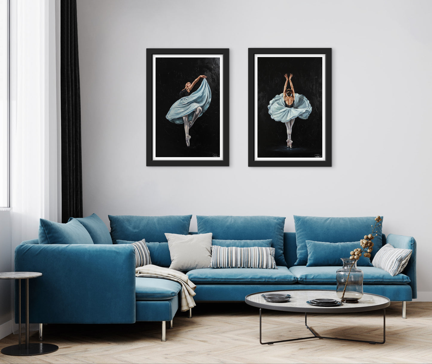 Posters hanging on a wall over a blue sofa 