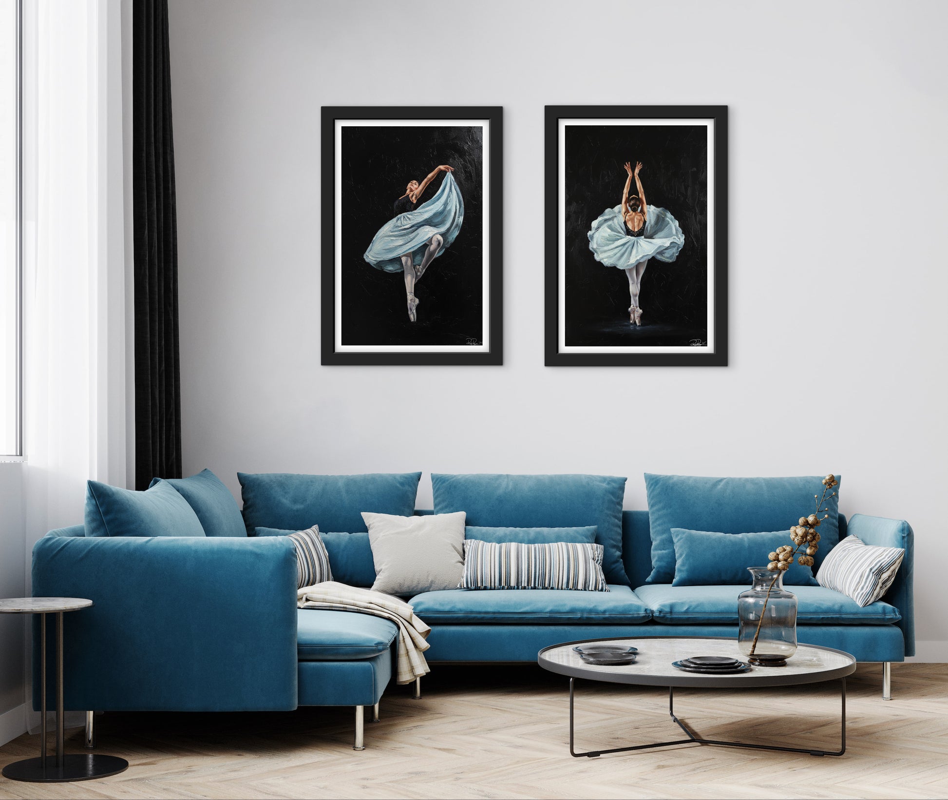Posters hanging on a wall over a blue sofa 