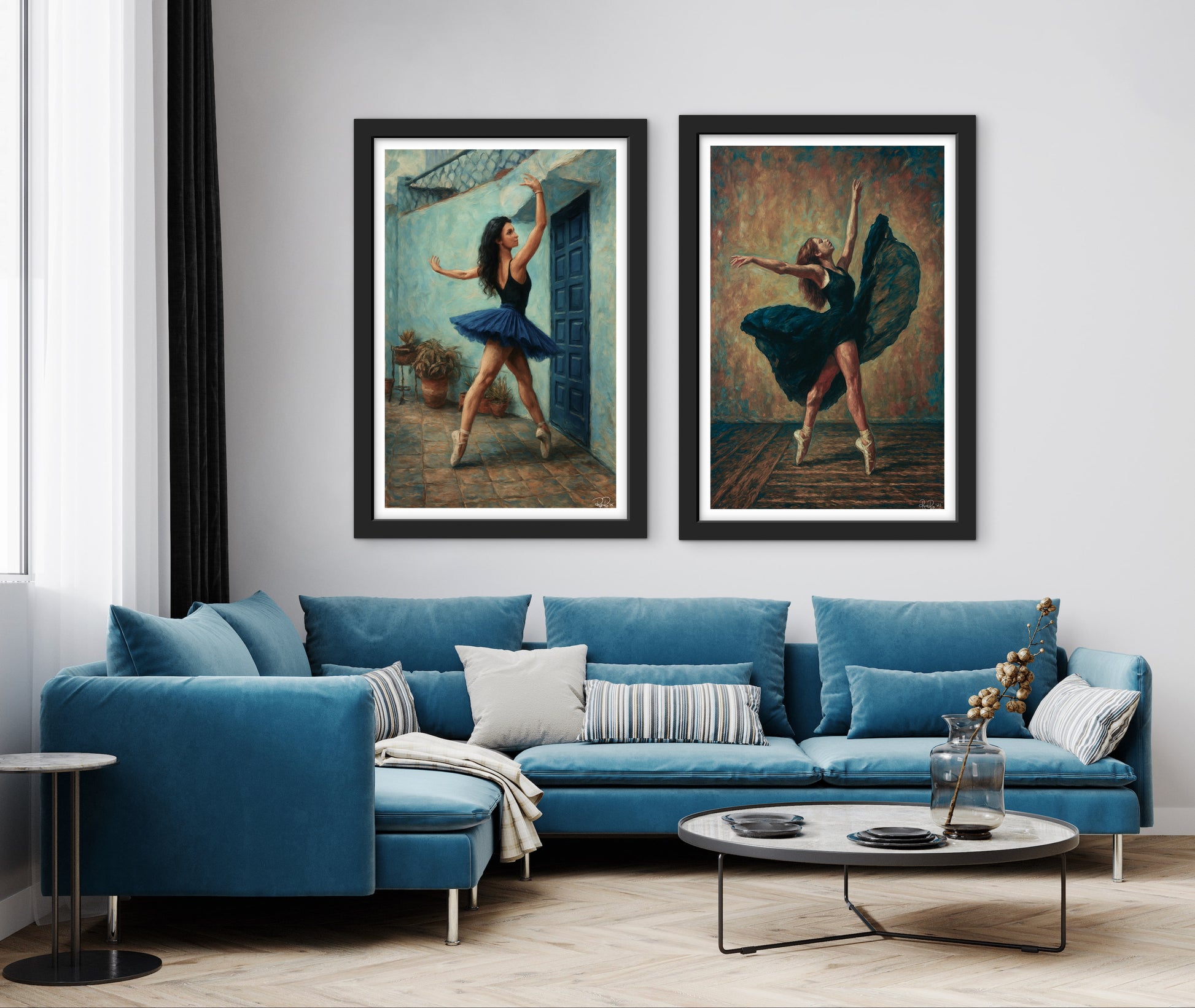 Living room with a blue sofa, round coffee table, and framed ballet dancer art on the wall.