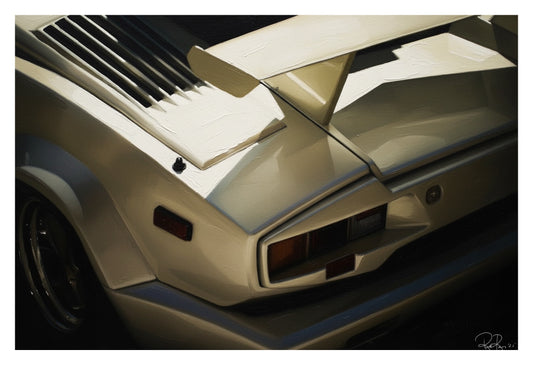 Close-up of a car's hood with a prominent air intake and spoiler.