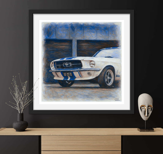 Framed artwork of a classic car on a dark wall with decorative items.