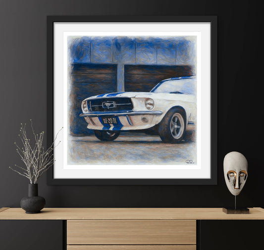 Framed artwork of a classic car on a dark wall with decorative items.