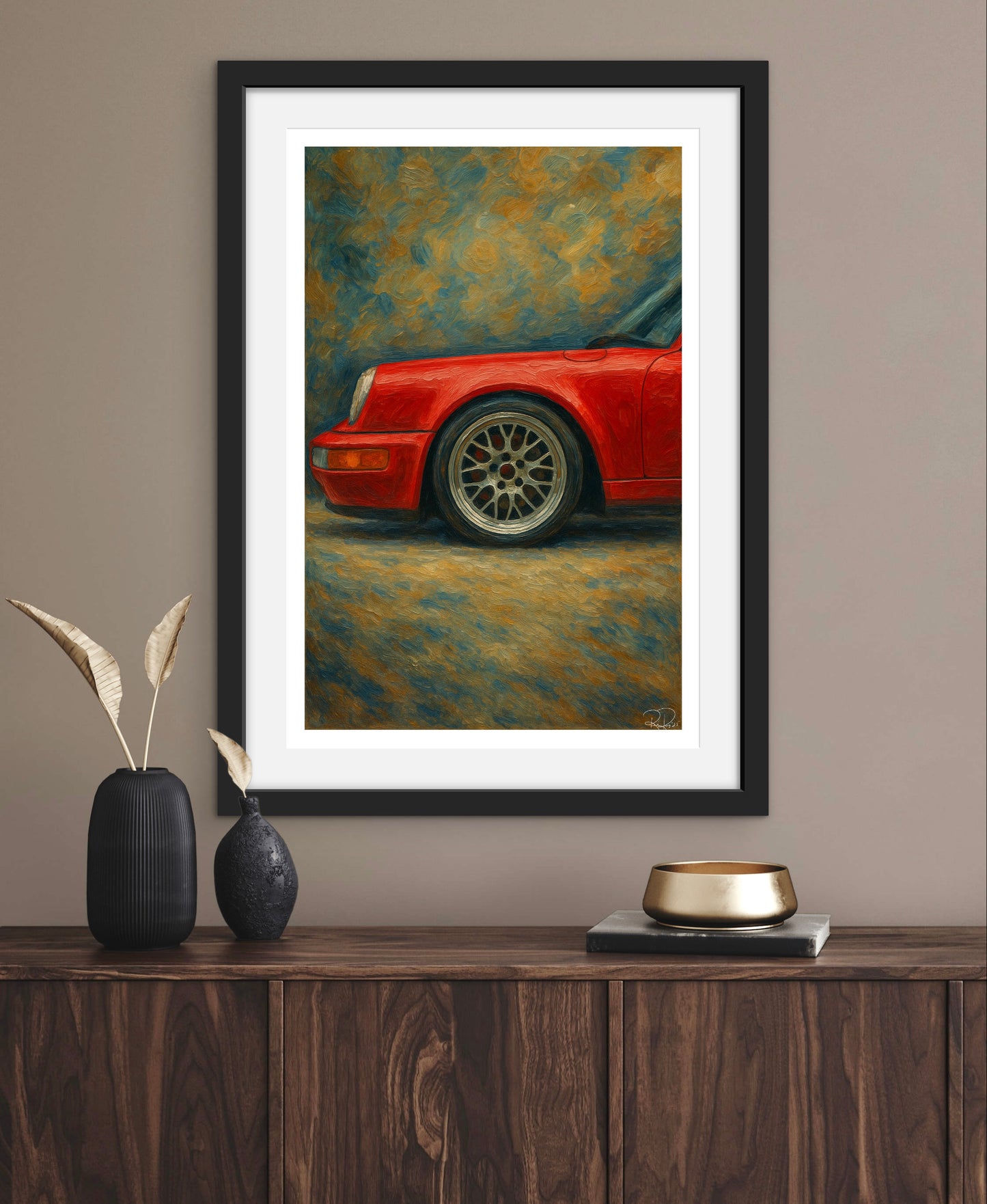 Framed painting of a red car on a wall above a wooden console table.