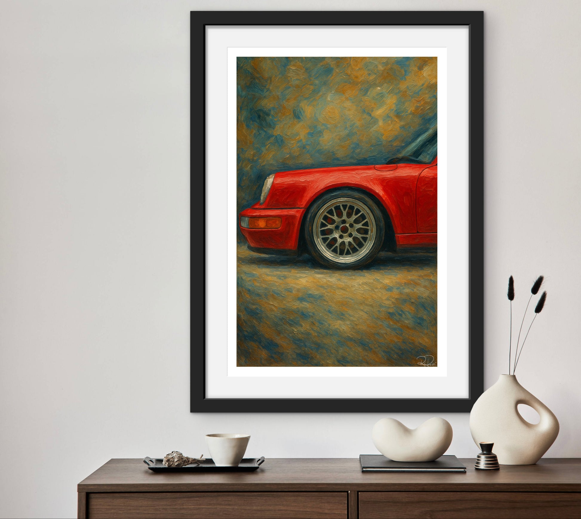 Framed painting of a red car on a wall above a wooden console table with decorative items.