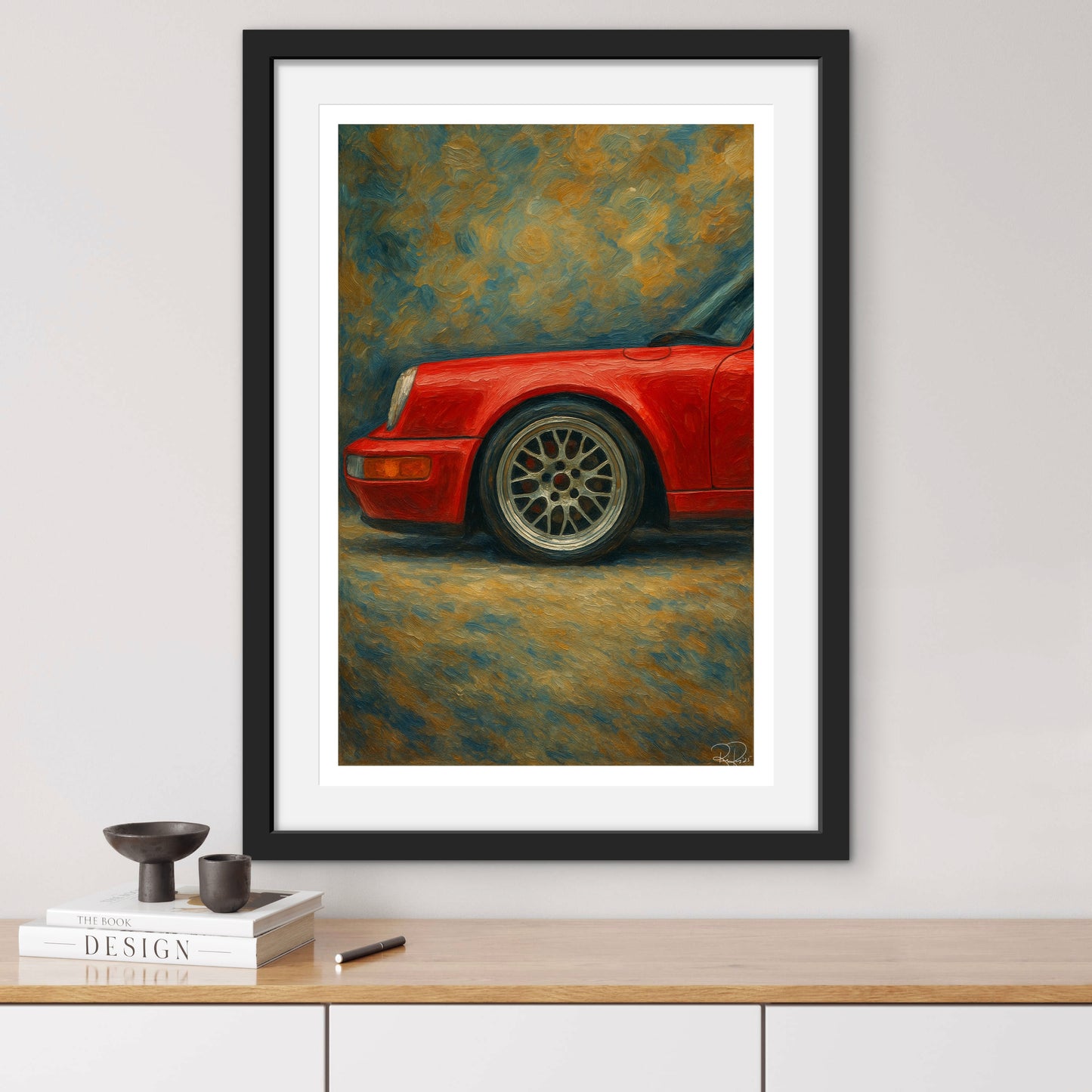 Framed painting of a red car on a wall above a wooden shelf.