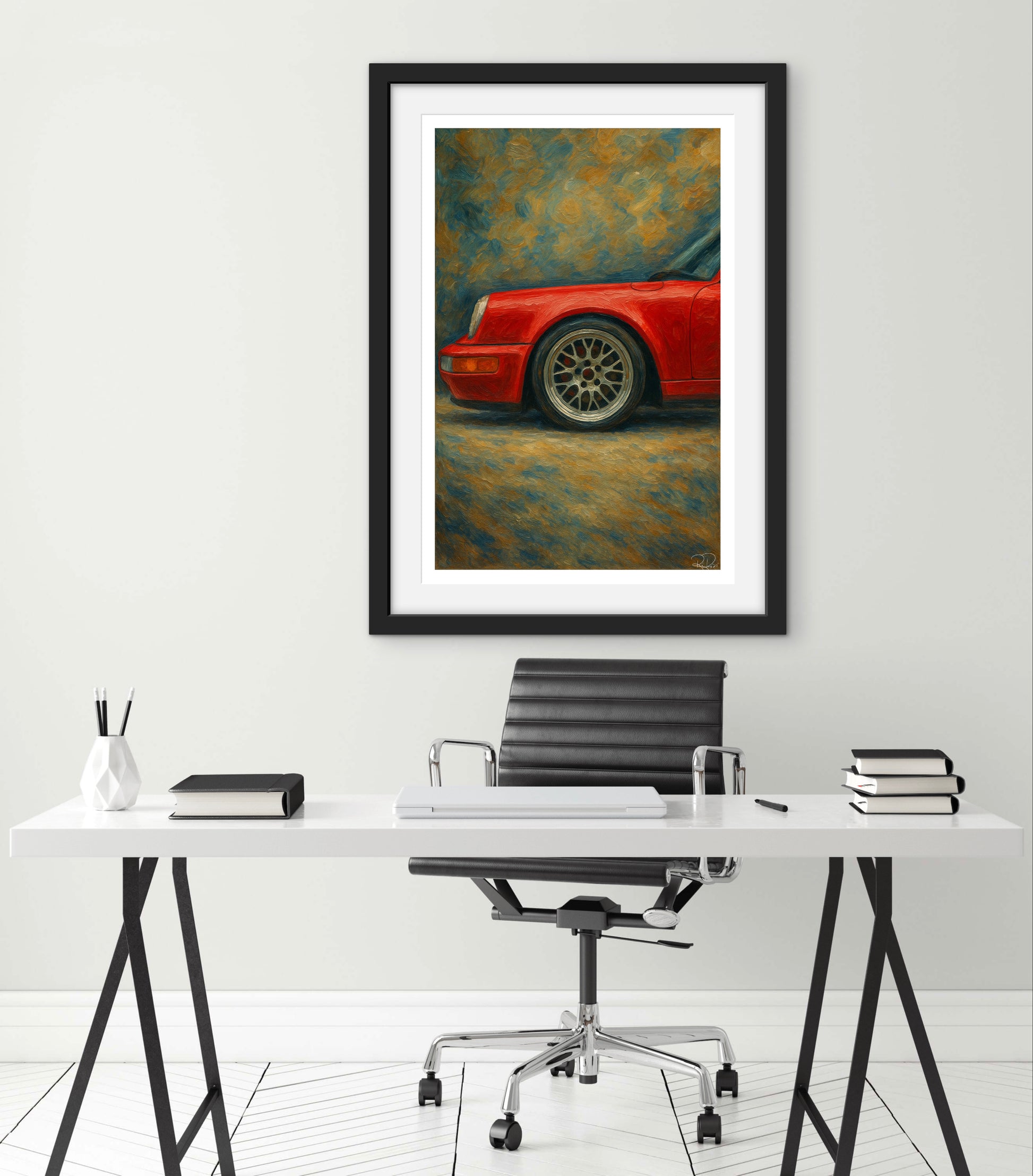 Framed artwork of a red car on a white wall above a desk with office furniture.