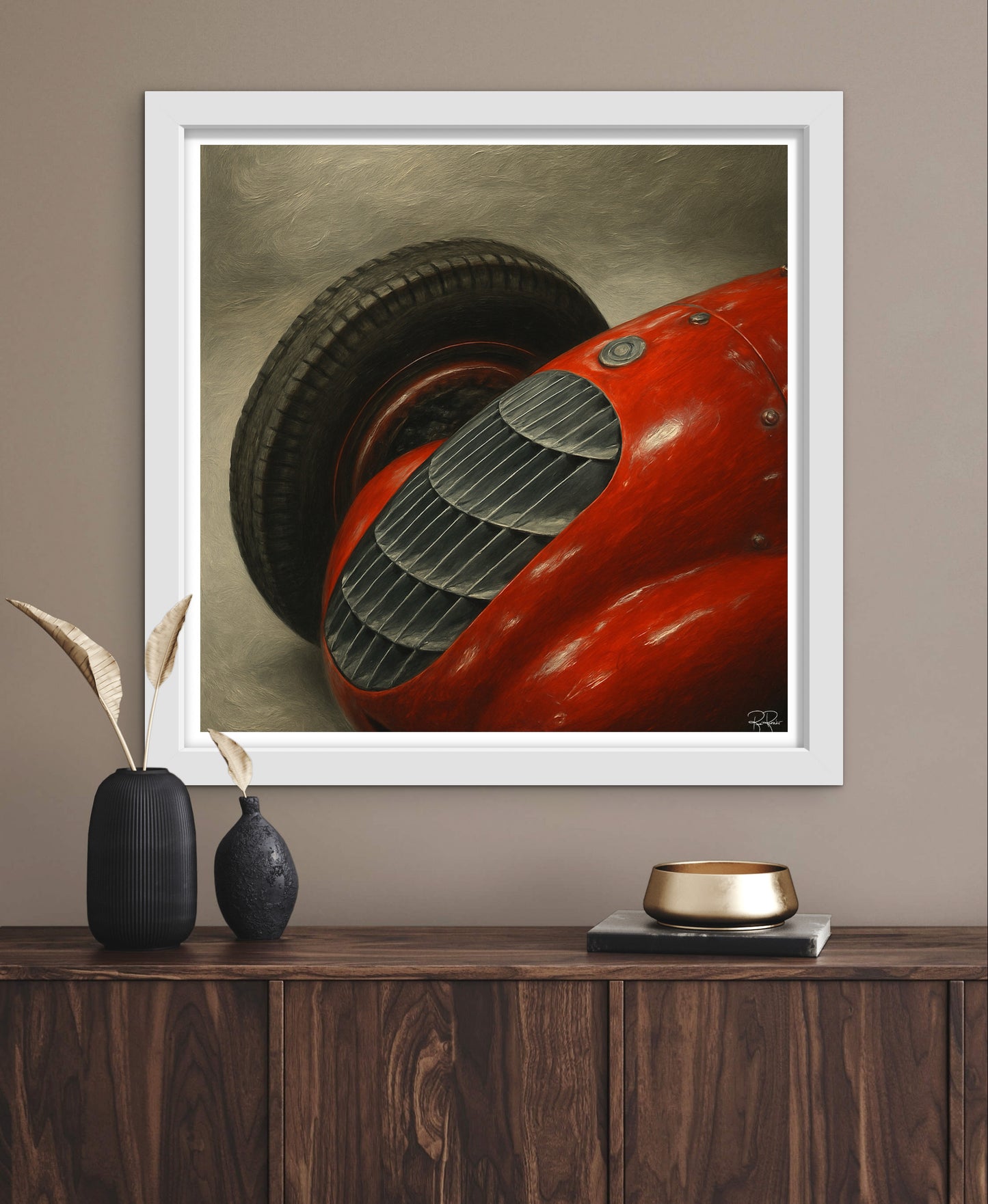 Framed artwork of a red car on a wooden shelf with decorative items.