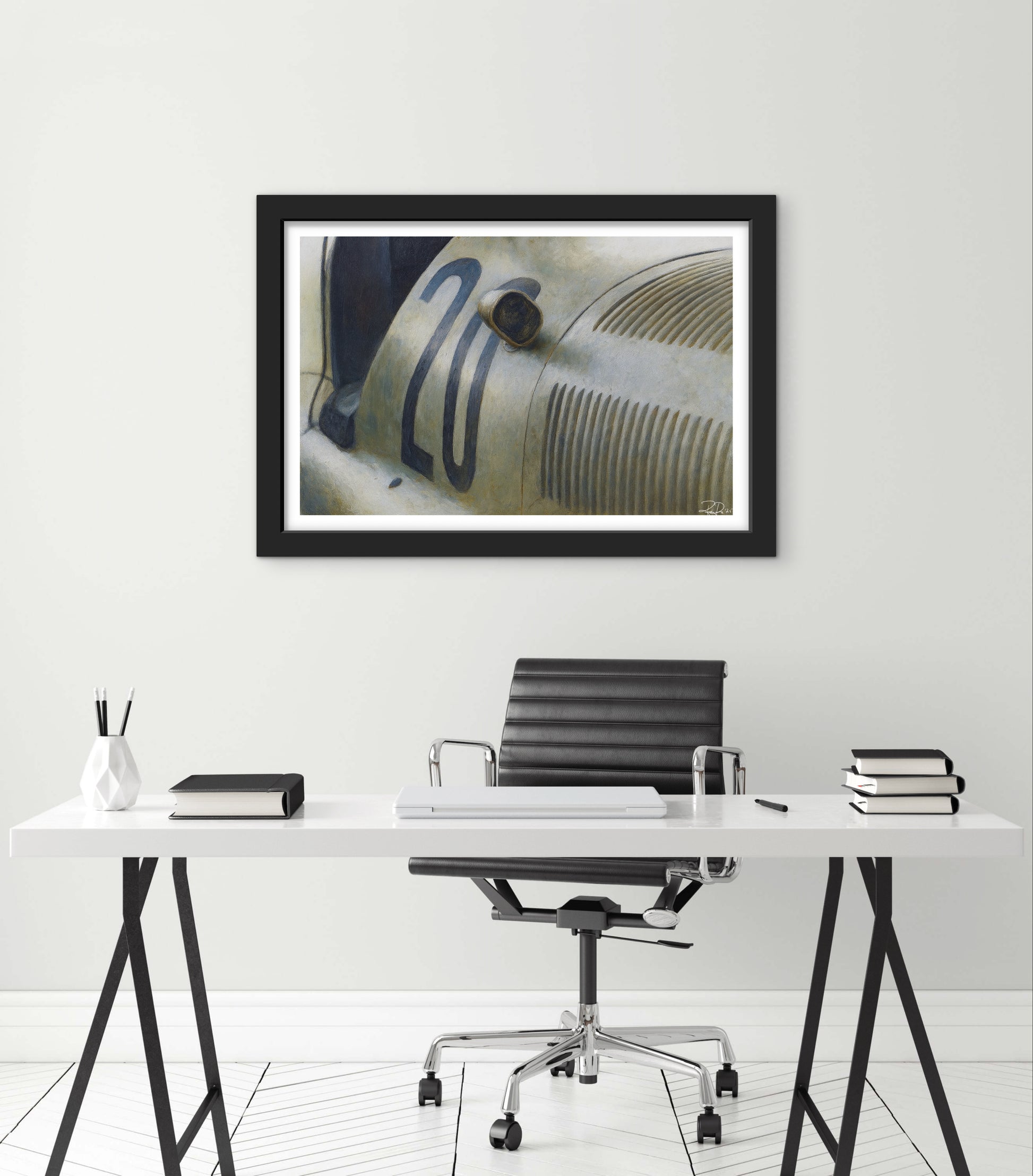 Modern office setup with a desk, chair, and framed picture on the wall.