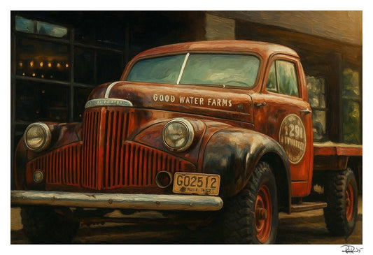 Rustic old truck with 'Good Water Farms' branding in a dimly lit setting.