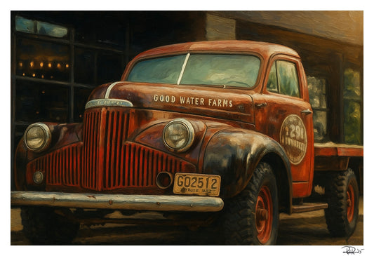 Rustic old truck with 'Good Water Farms' branding in a dimly lit setting.
