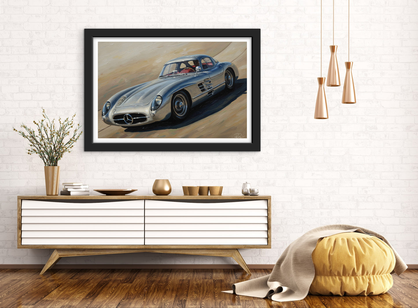 Framed artwork of a classic car on a wall above a wooden console table.