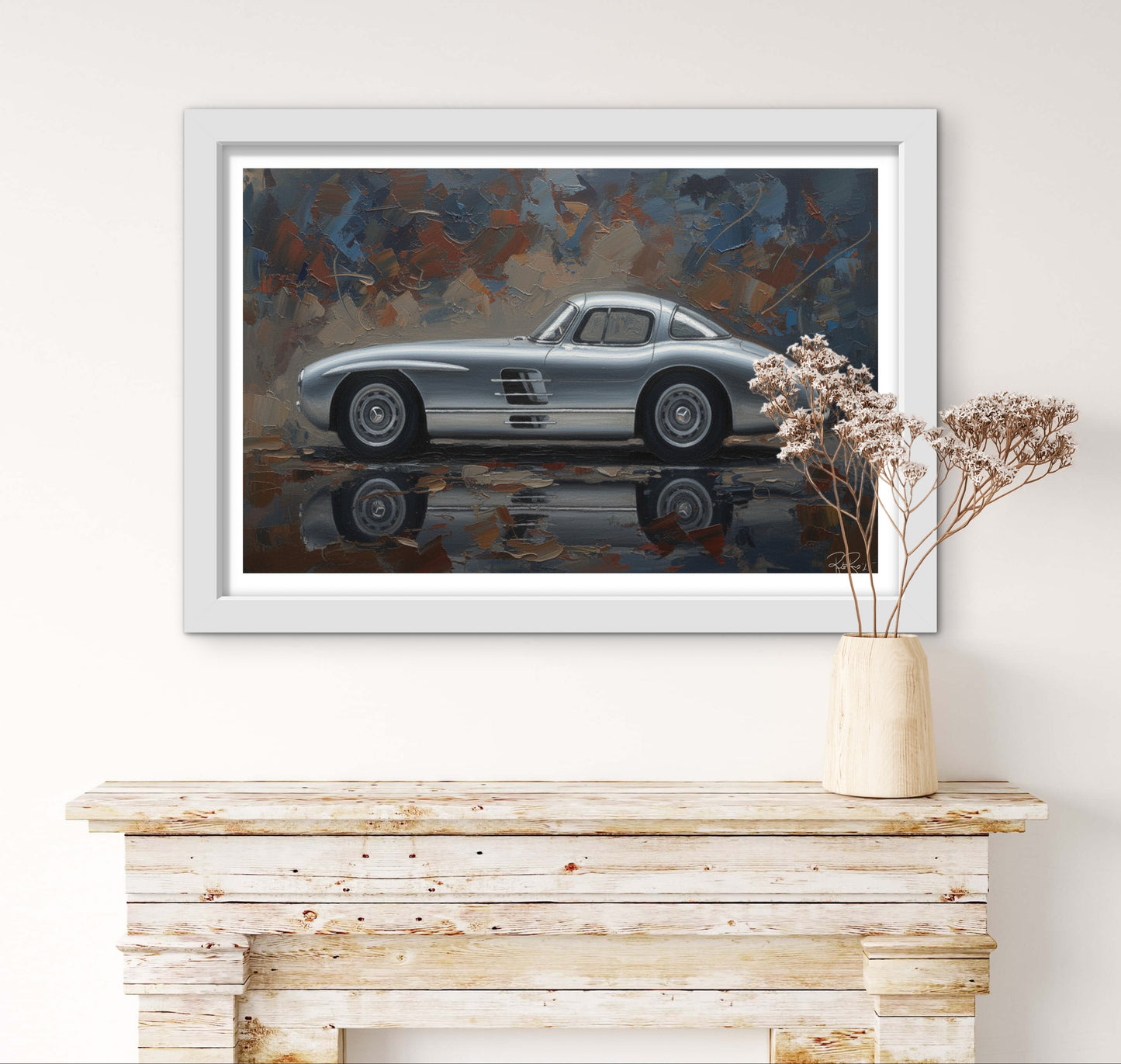 Framed artwork of a classic car on a wall above a wooden console table.