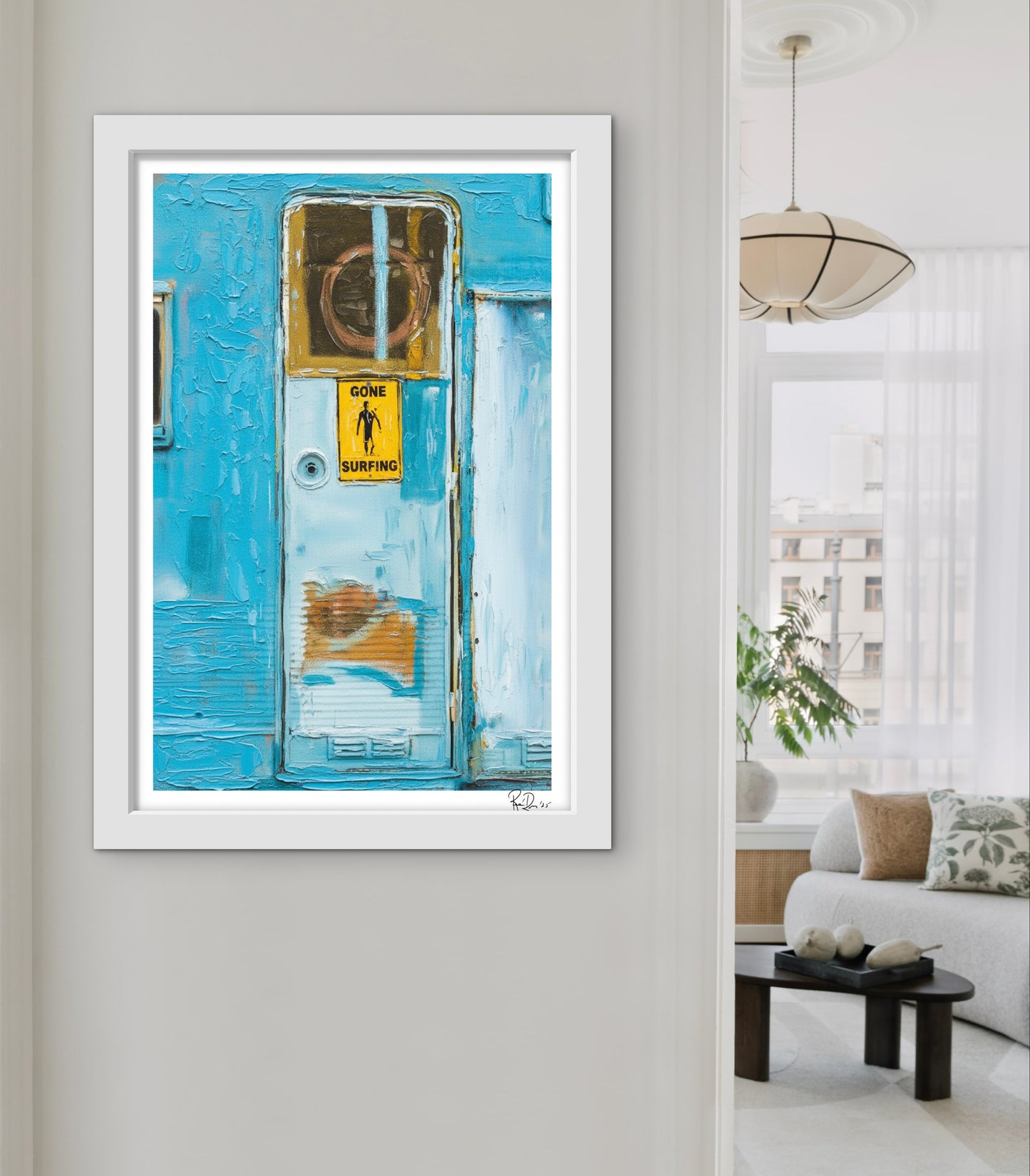 Framed artwork of a blue door with a yellow sign in a living room setting