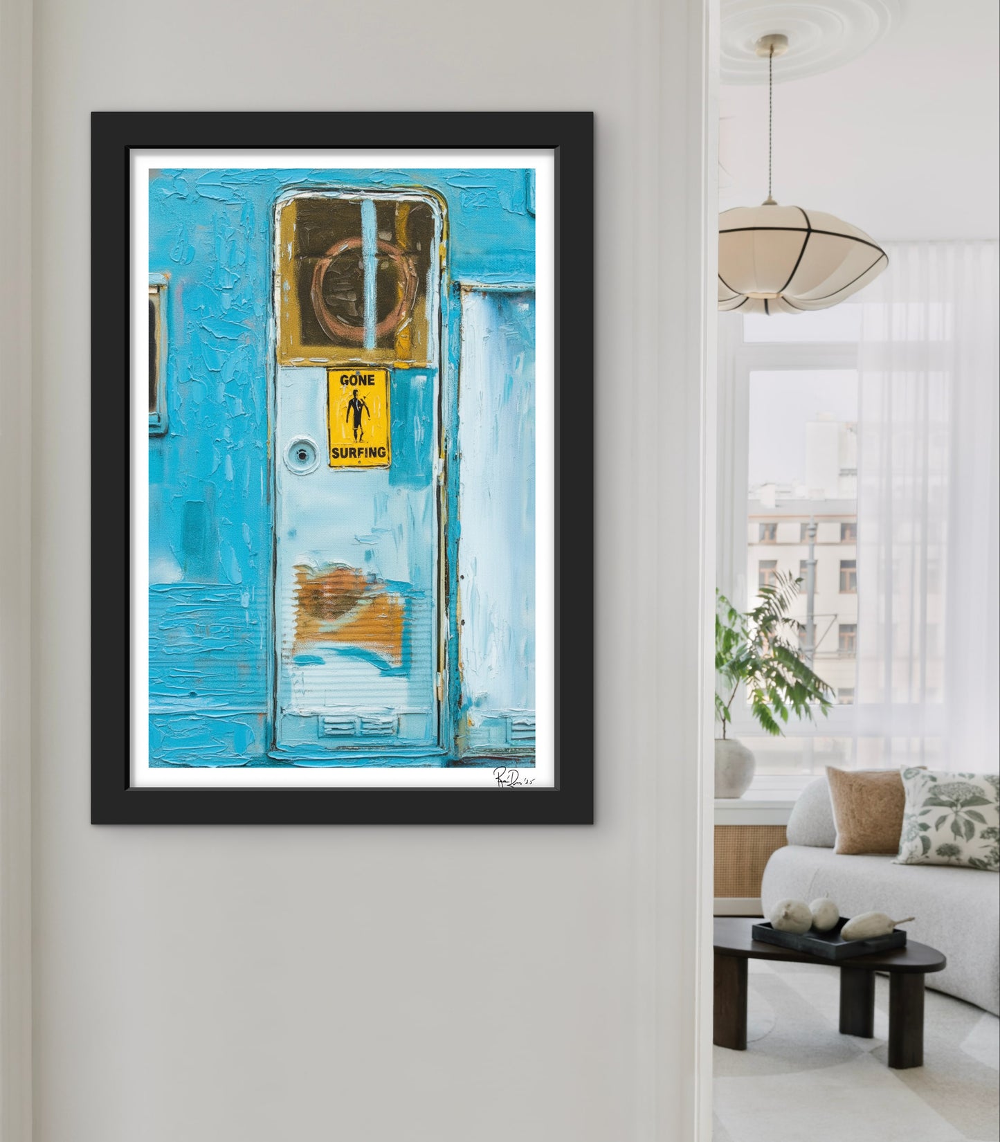 Framed artwork of a blue door with a yellow sign in a living room setting