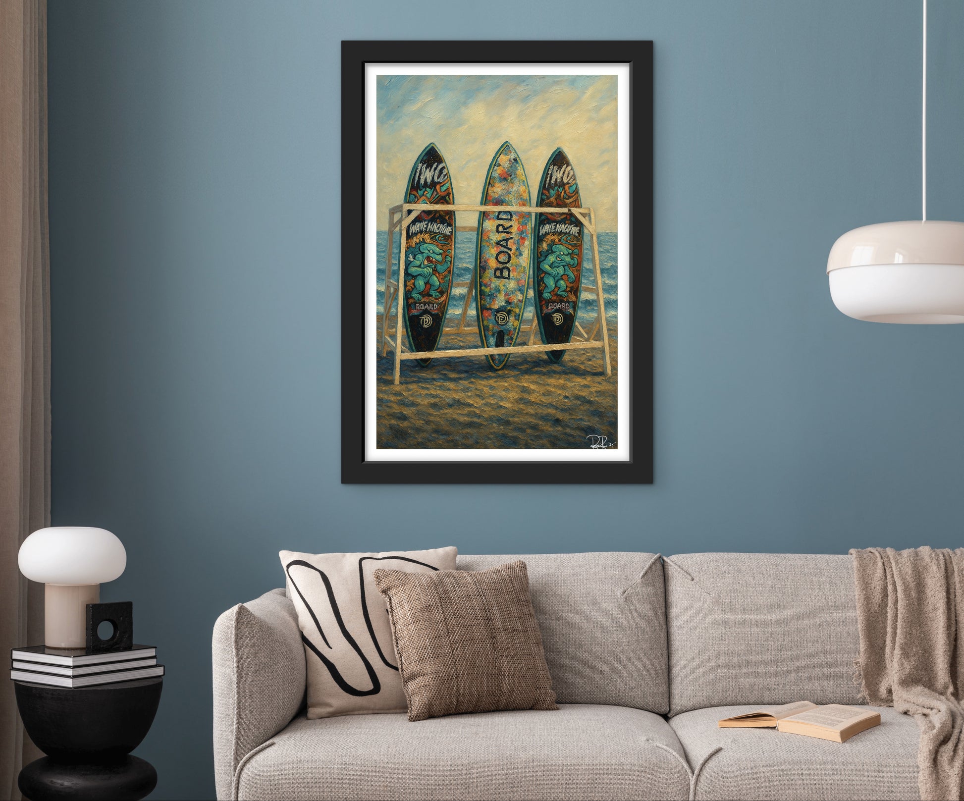 Framed artwork of surfboards on a wall above a sofa in a living room.