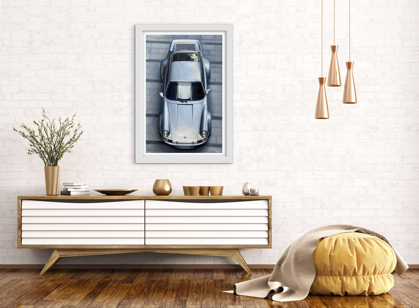 Modern living room with a console table, decorative items, and a framed picture of a car.
