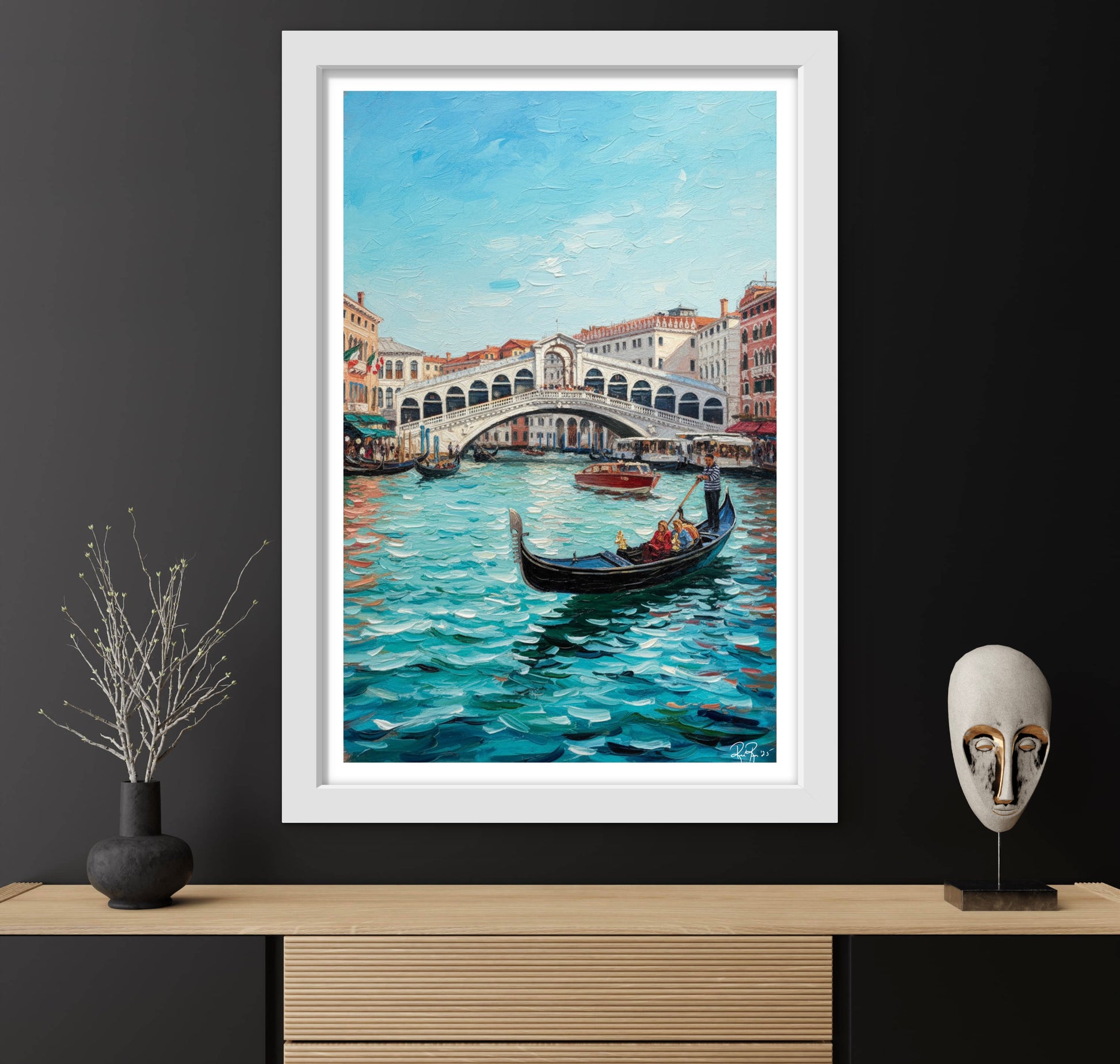 Framed painting of a Venetian scene with a bridge and gondola on a dark wall.