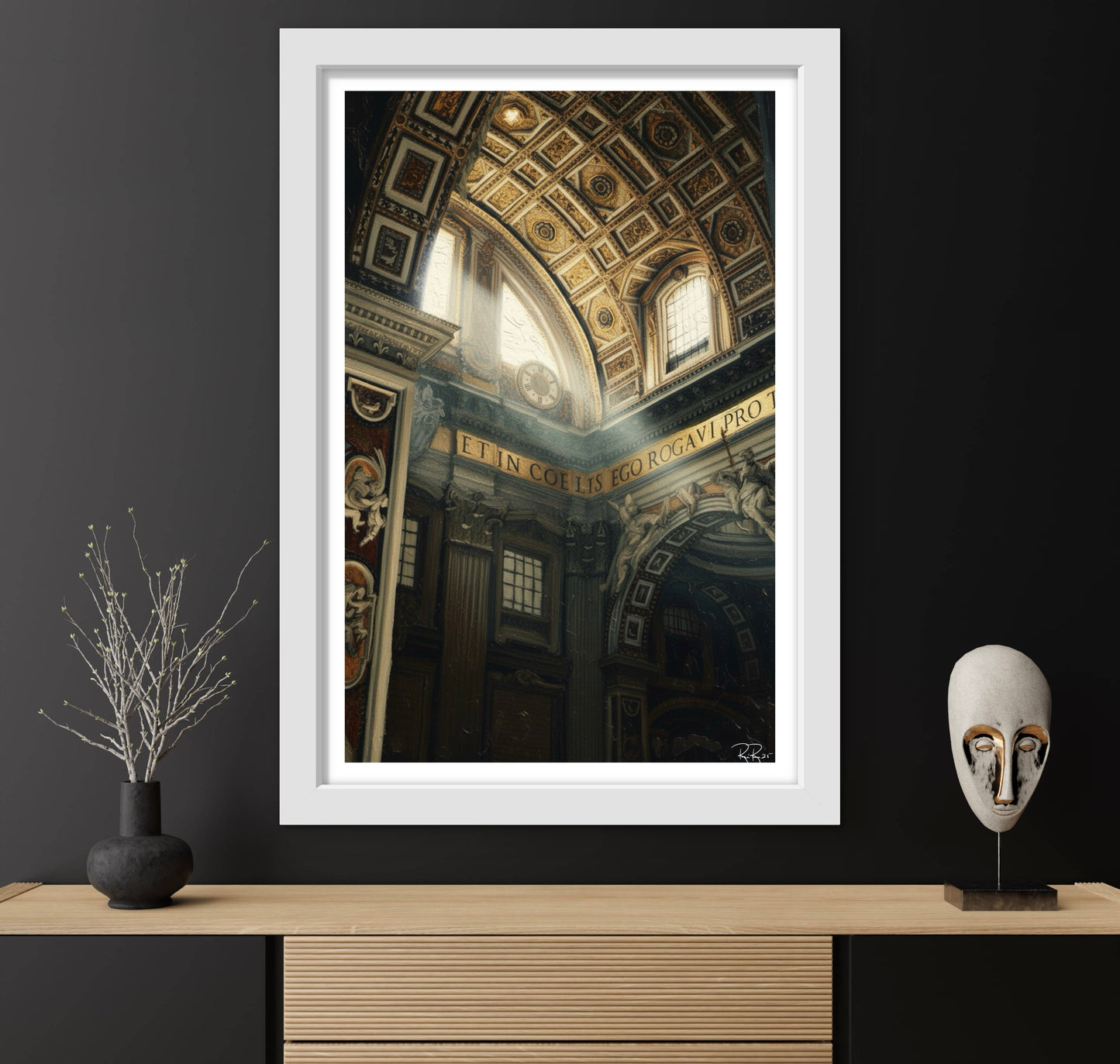 Framed artwork of an architectural interior on a dark wall with decorative items.