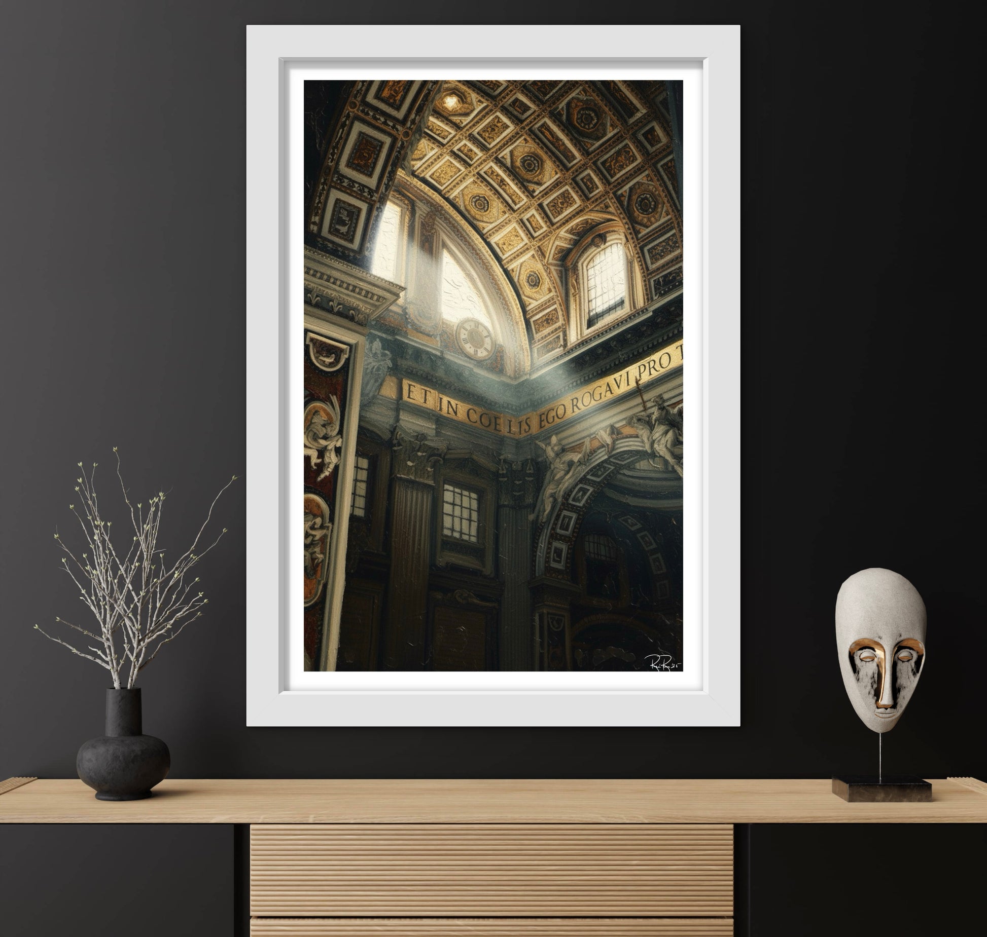 Framed artwork of an architectural interior on a dark wall with decorative items.