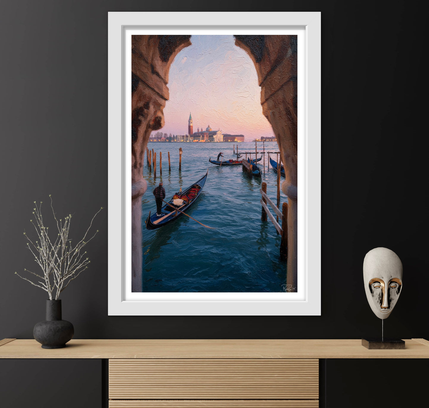 Framed photograph of a Venetian canal with gondolas and a cityscape, displayed on a dark wall with decorative items.