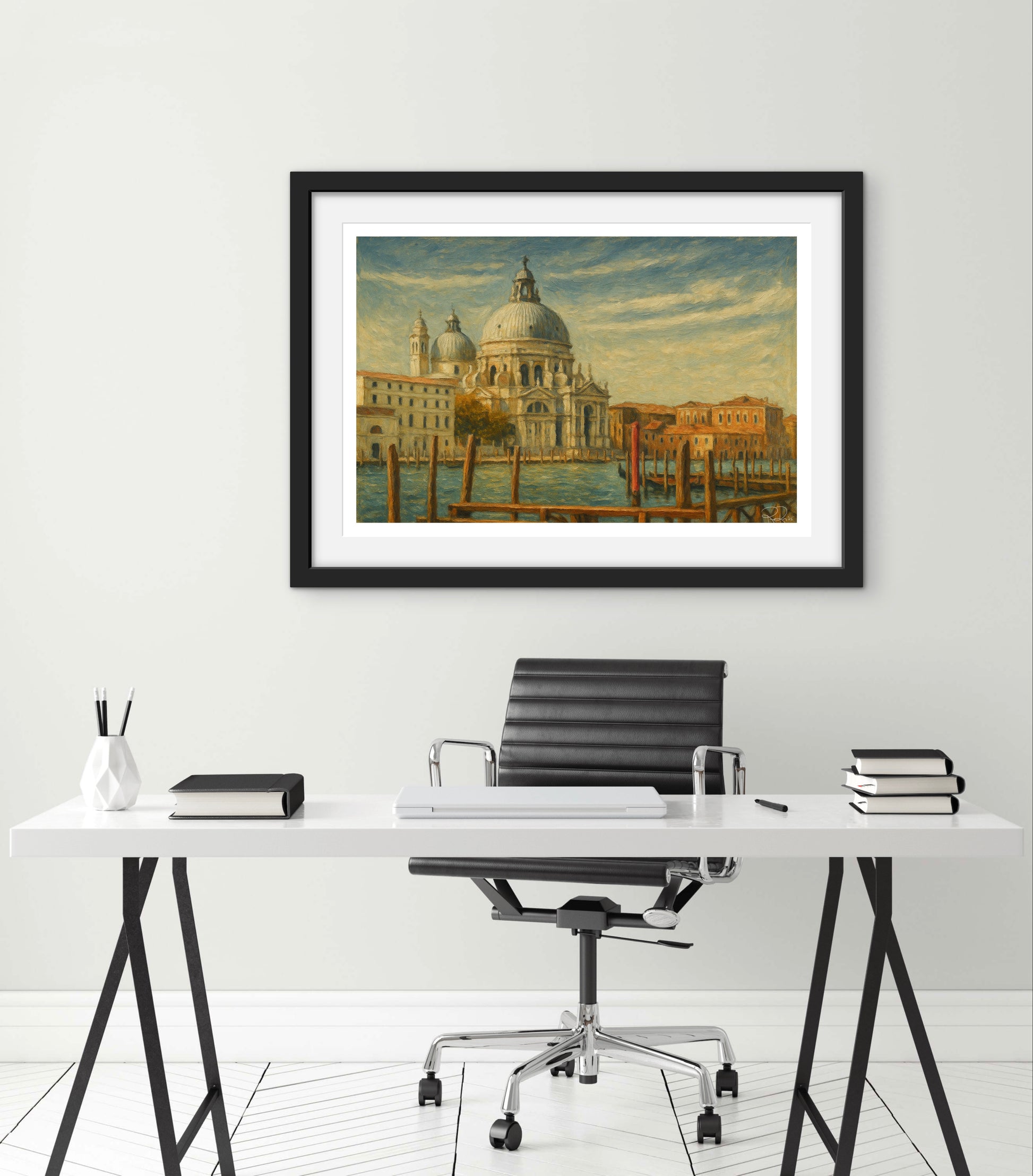 Framed artwork of a cityscape above a modern office desk with a chair.