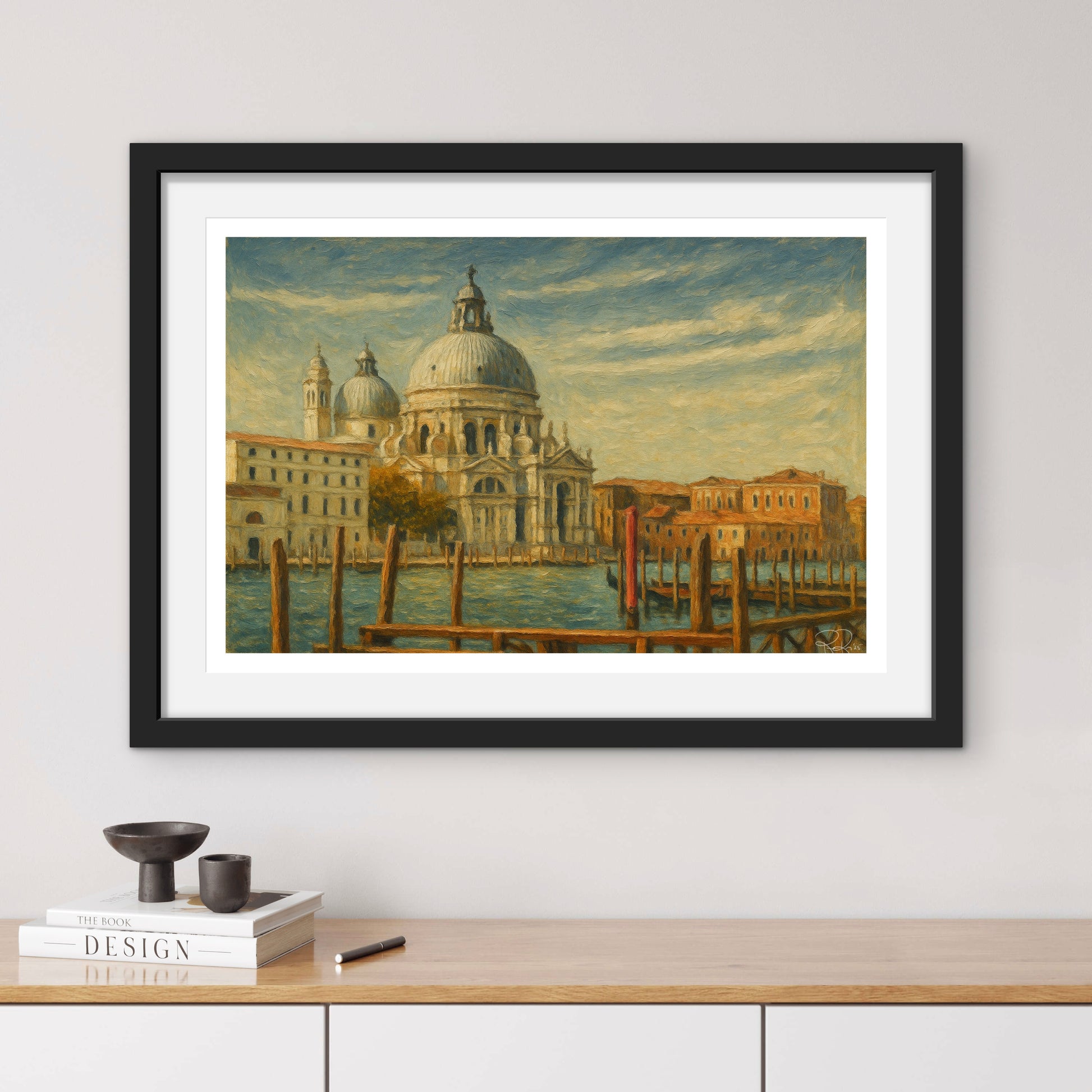 Framed artwork of a cityscape with a dome on a wall above a wooden shelf.