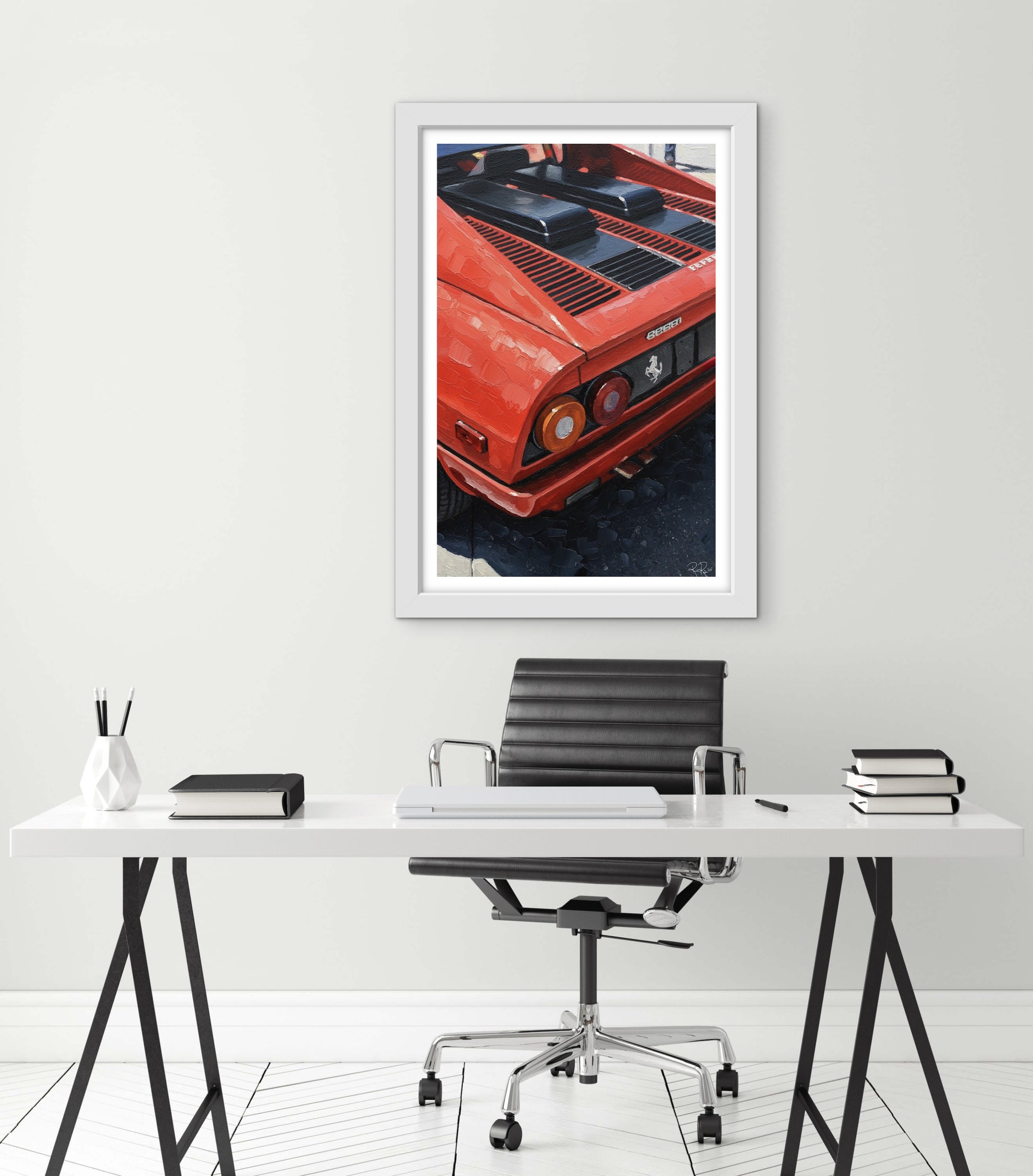 Framed picture of a red car above a desk with office furniture.